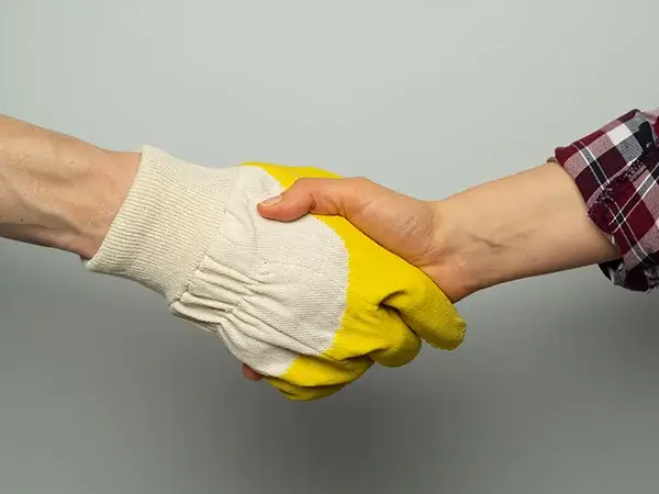 Worker and client shaking hands
