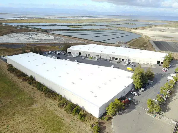 Warehouse buildings with new TPO roof systems installed