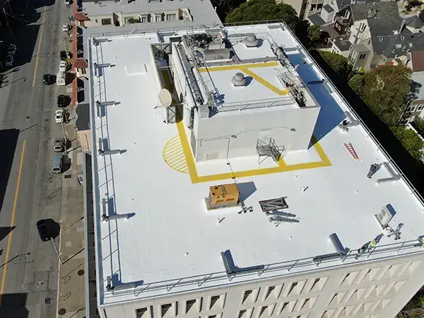 Tall commercial building with new TPO roof system installed